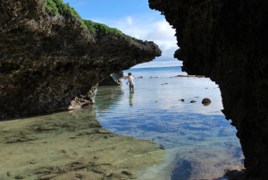 Walking around the island, failed flip-flops in hand.