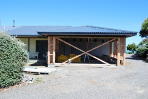 This is where we are at the end of the year... garage with roof, but no walls yet!