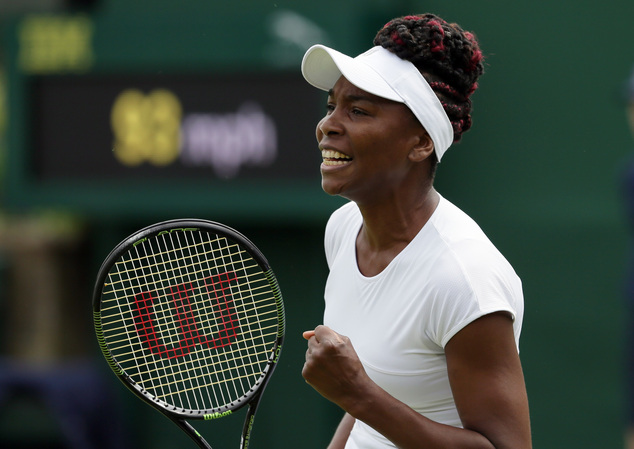 Venus Williams of the U.S celebrates a point against Maria Sakkari of Greece during their women's singles match on day four of the Wimbledon Tennis Championships in London, Thursday, June 30, 2016. (AP Photo/Tim Ireland)